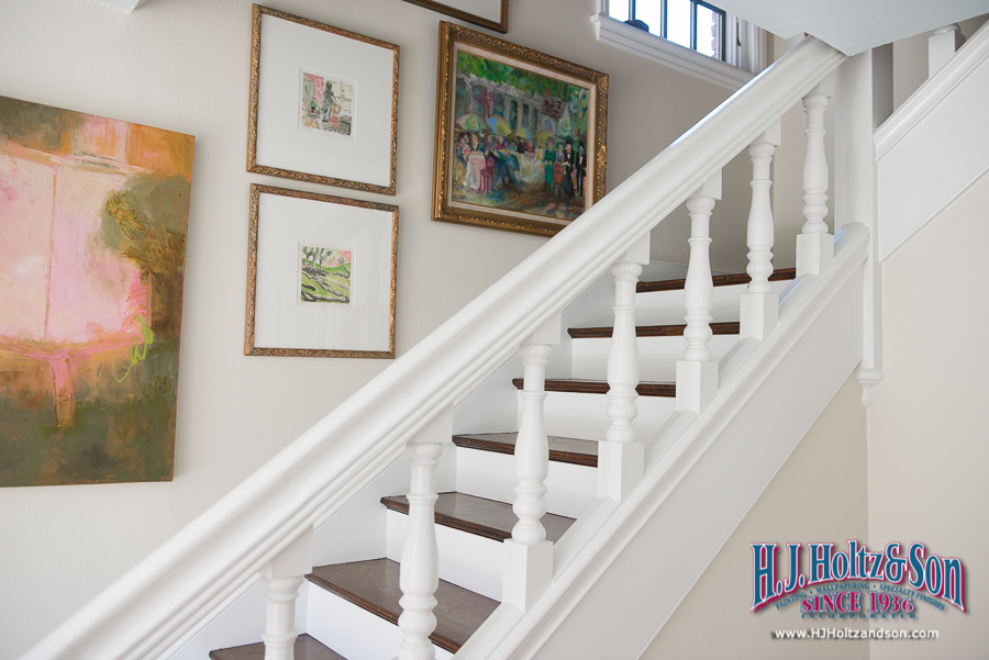 Paint stained woodwork to brighten up a stairway